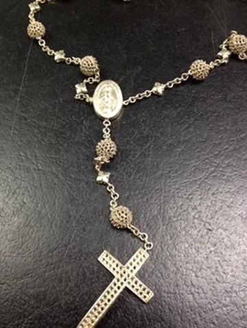 Cross pendant on detailed chain